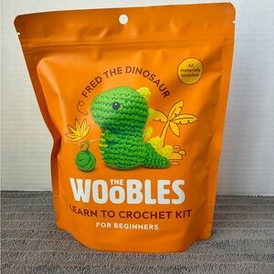 The Woobles Fred the Dinosaur Crochet Kit - Green and Orange